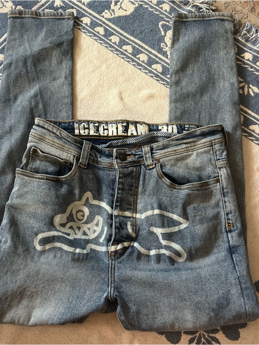 billionaire boys club lightwash blue designer skinny jeans with dog logo on fron